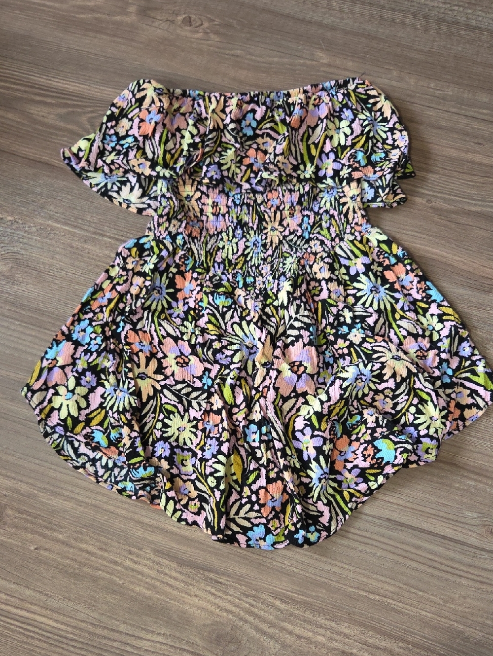 Floral Promesa Off-Shoulder Smocked Romper in Black with Pastel Blooms